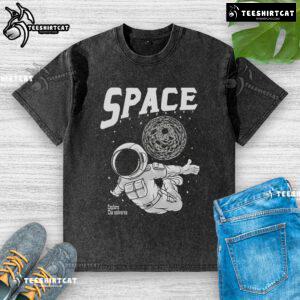 Pretty space astronaut exploring the universe on a washed t-shirt, perfect for cosmic adventure enthusiasts.