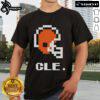 Alt Text: Top Cleveland Browns football helmet pixel T-shirt design featuring a vibrant graphic and team colors.