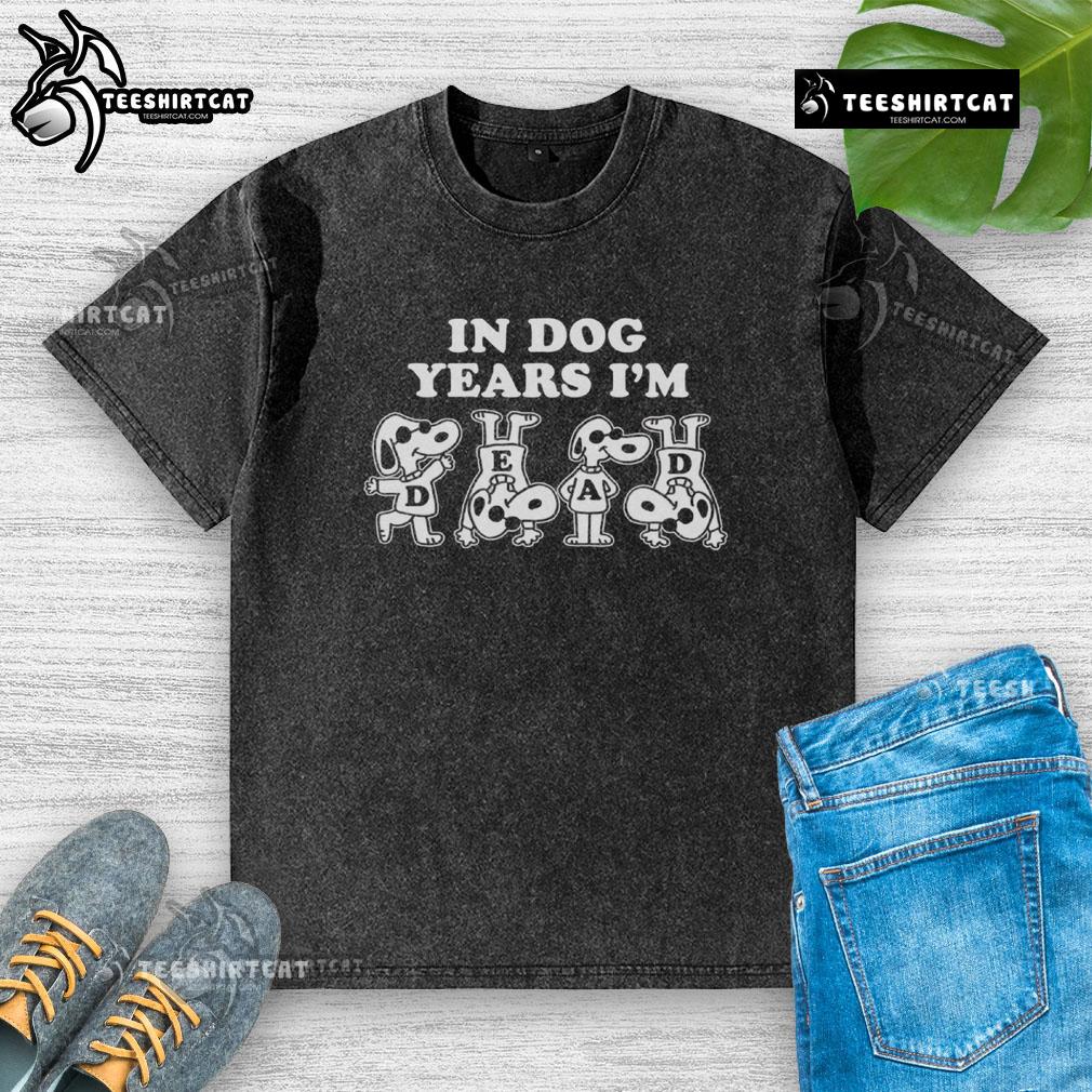 Alt Text: Cute Snoopy 'In Dog Years I'm Dead' graphic on a casual washed t-shirt, perfect for dog lovers and fans of Peanuts.