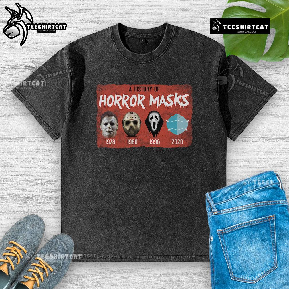 Funny history of horror mask graphic on a washed t-shirt, perfect for horror movie fans and casual wear.