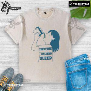 Funny 'Thriving on Zero Sleep' coffee washed t-shirt design featuring a humorous coffee cup graphic.