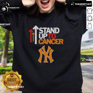Hot Stand Up To Cancer New York Yankees sweatshirt featuring bold logo and vibrant colors, perfect for fans.