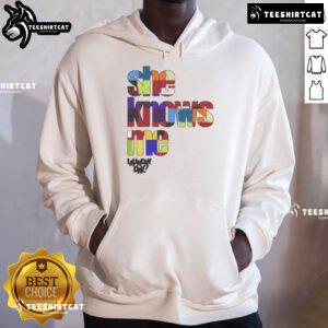 Stylish woman wearing a 'Nice Daundry Lay She Knows Me' hoodie, showcasing casual fashion and comfortable streetwear style.