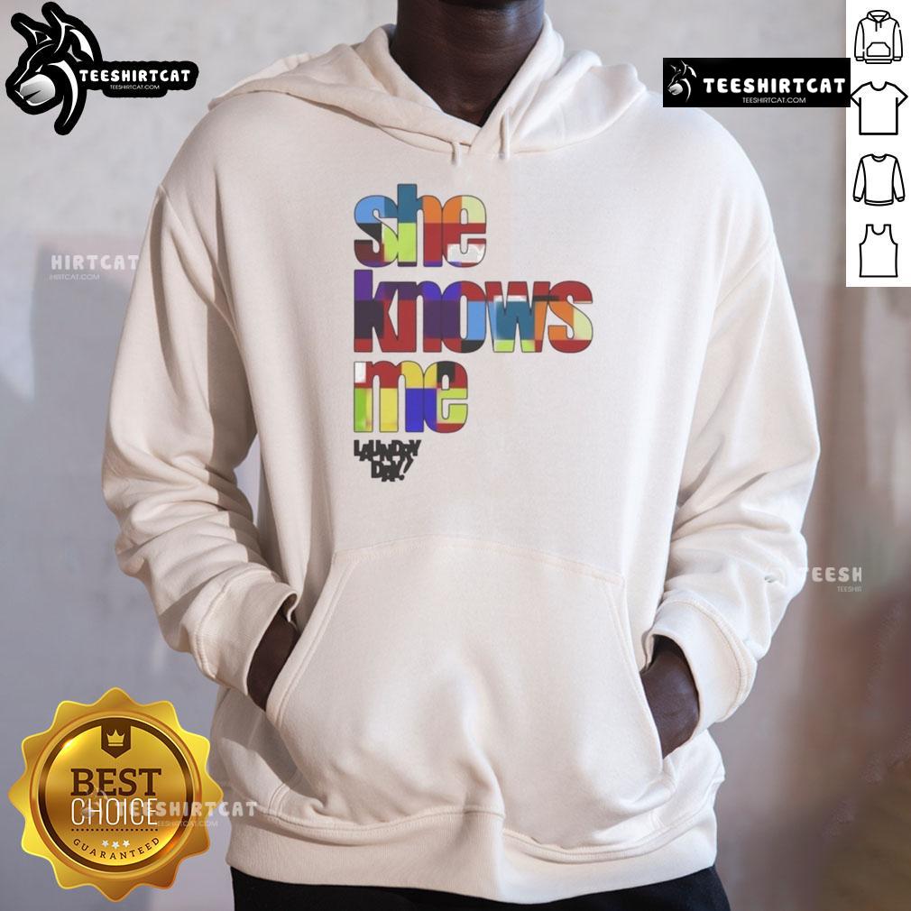 Stylish woman wearing a 'Nice Daundry Lay She Knows Me' hoodie, showcasing casual fashion and comfortable streetwear style.