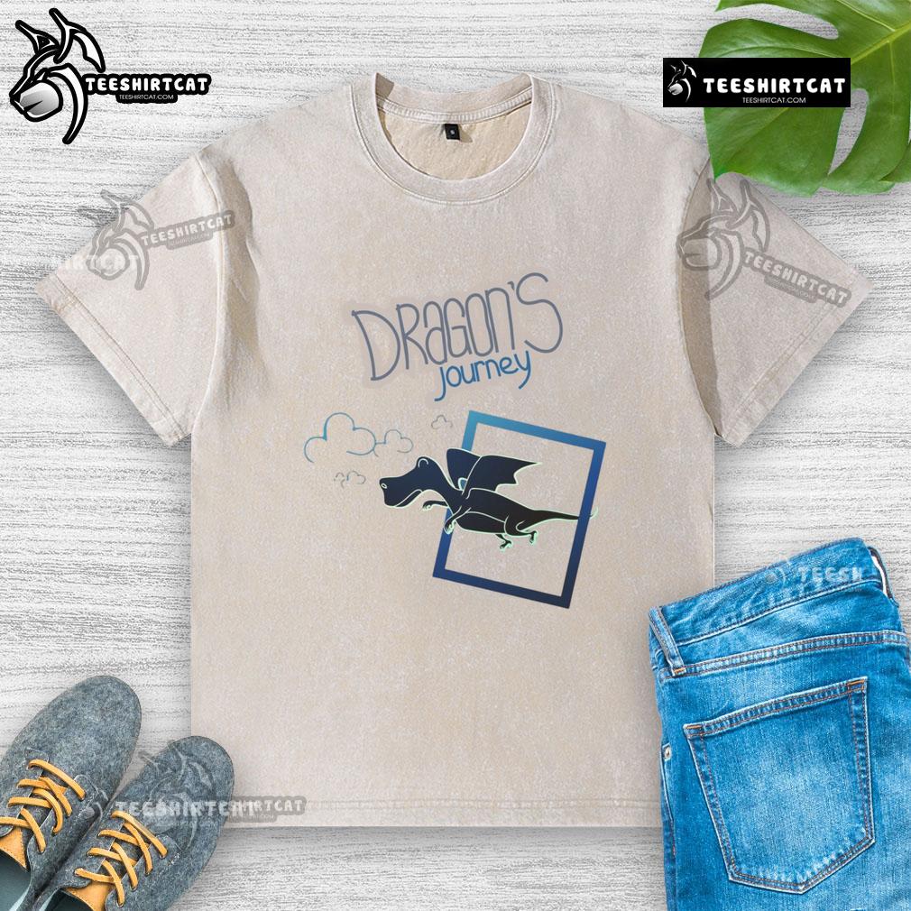 Alt Text: Cartoon fantasy dragon flying on a washed t-shirt, showcasing a vibrant design from Nice Dragon's Journey.