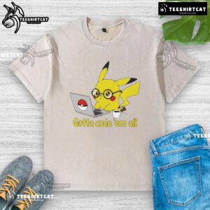 Alt Text: Cute Pikachu graphic on a washed t-shirt with 'Gotta Code 'Em All' slogan, perfect for Pokmon fans and coders.