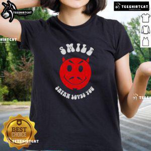 Nice Smile Satan Loves You Ladies Tee featuring a playful design with vibrant colors and a cheerful message.
