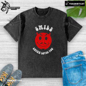 Nice Smile Satan Loves You washed t-shirt featuring a playful design and vibrant colors for casual wear.