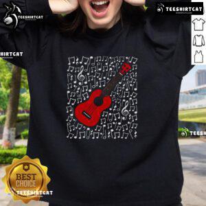 Musician wearing 'Nice Ukulele' sweatshirt, playing ukulele with musical notes in the background, perfect for music teachers.