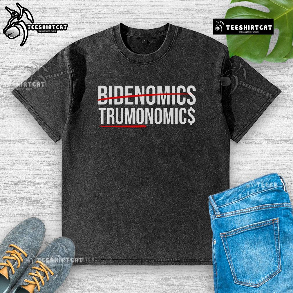 Alt Text: Official Bidenomics Maganomics washed t-shirt featuring bold graphics and a vintage look for political apparel enthusiasts.