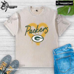 Alt Text: Official Green Bay Packers Football Spray Heart Washed T-Shirt featuring a stylish design for passionate fans.