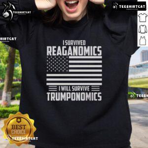 Cozy sweatshirt featuring 'I Survived Reaganomics, I Will Survive Trumponomics' slogan, perfect for political enthusiasts.