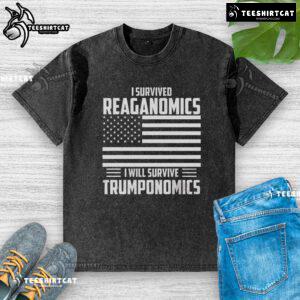 Alt Text: Official I Survived Reaganomics I Will Survive Trumponomics washed t-shirt with bold text design.