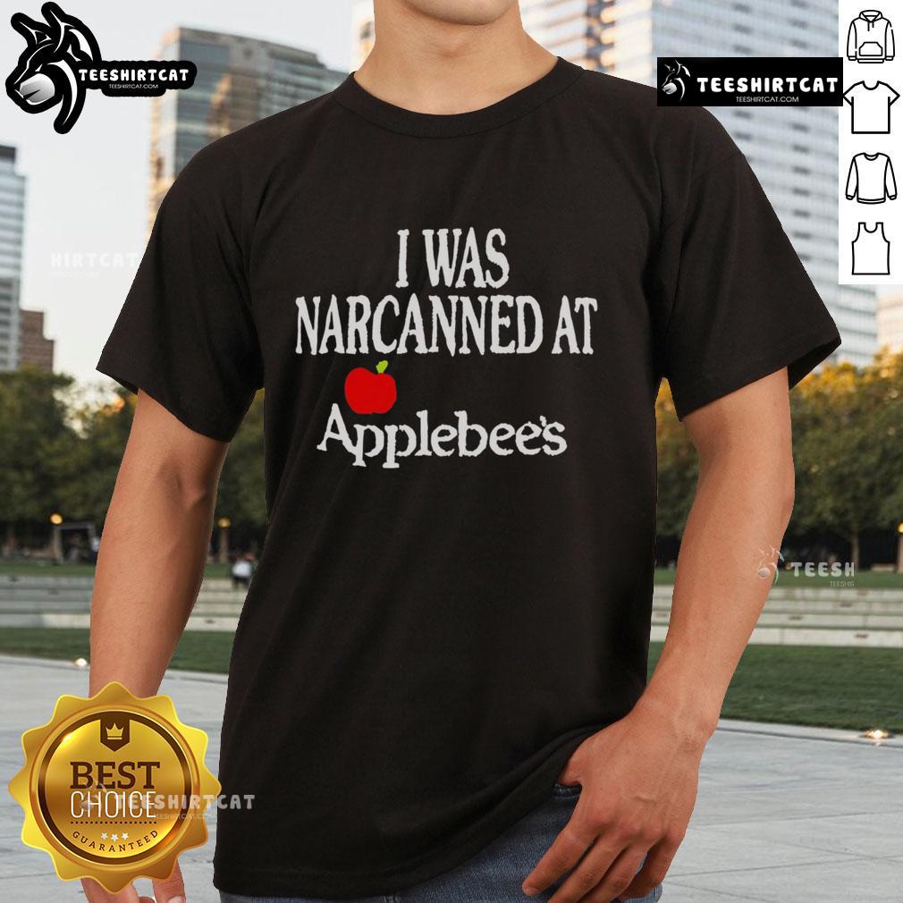 Official 'I Was Narcanned At Apple' T-Shirt featuring bold text on a stylish black background, perfect for Apple fans.