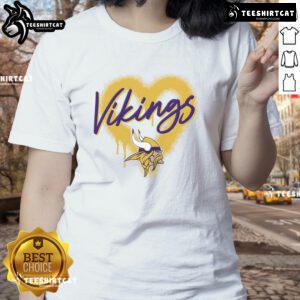 Official Minnesota Vikings Football Spray Heart Ladies Tee, stylish women's shirt featuring Vikings colors and logo.