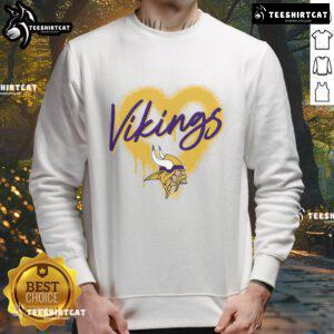 Alt Text: Official Minnesota Vikings Football Spray Heart Sweatshirt featuring a stylish design in team colors for fans.