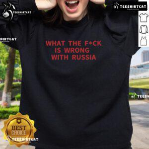 Alt Text: Official 'What The F*ck Is Wrong With Russia' sweatshirt featuring bold text design on a stylish black background.