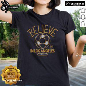 Alt Text: Premium LAFC Homage MLS x Ted Lasso Believe Ladies Tee featuring a stylish design for soccer fans and apparel lovers.