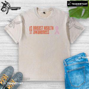 Alt Text: Premium WNBA Breast Health Awareness 20th Anniversary washed t-shirt showcasing vibrant design and supportive message.
