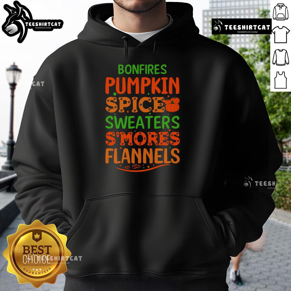 Cozy fall scene with bonfires, pumpkin spice, flannels, and hoodies, perfect for enjoying s'mores in autumn evenings.
