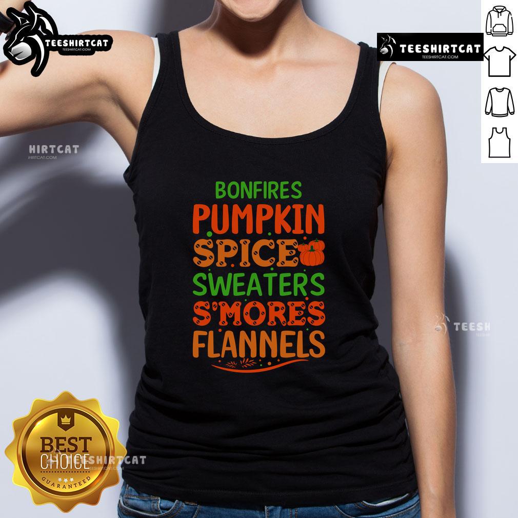 Cozy bonfire scene featuring pumpkin spice sweaters, smores, flannels, and a stylish tank top for fall vibes.