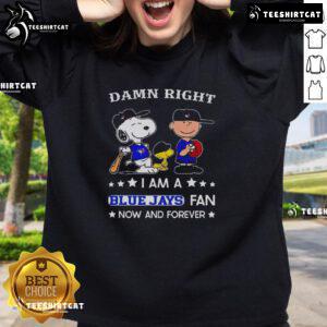 Blue Jays fan sweatshirt featuring Snoopy and Charlie Brown, perfect for showing team spirit and style.