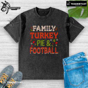 Happy family enjoying turkey pie and football, wearing washed T-shirts for a cozy holiday celebration.