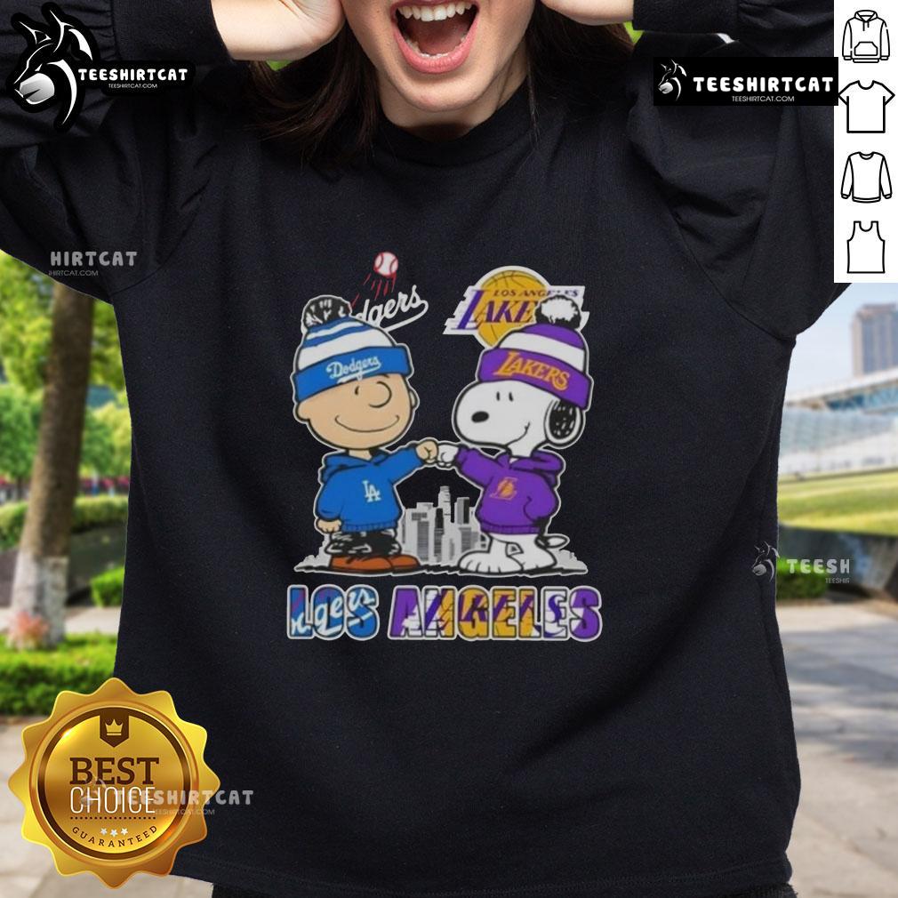 Alt Text: Cute Snoopy and Charlie Brown sweatshirt featuring Los Angeles Dodgers and Lakers skyline design.