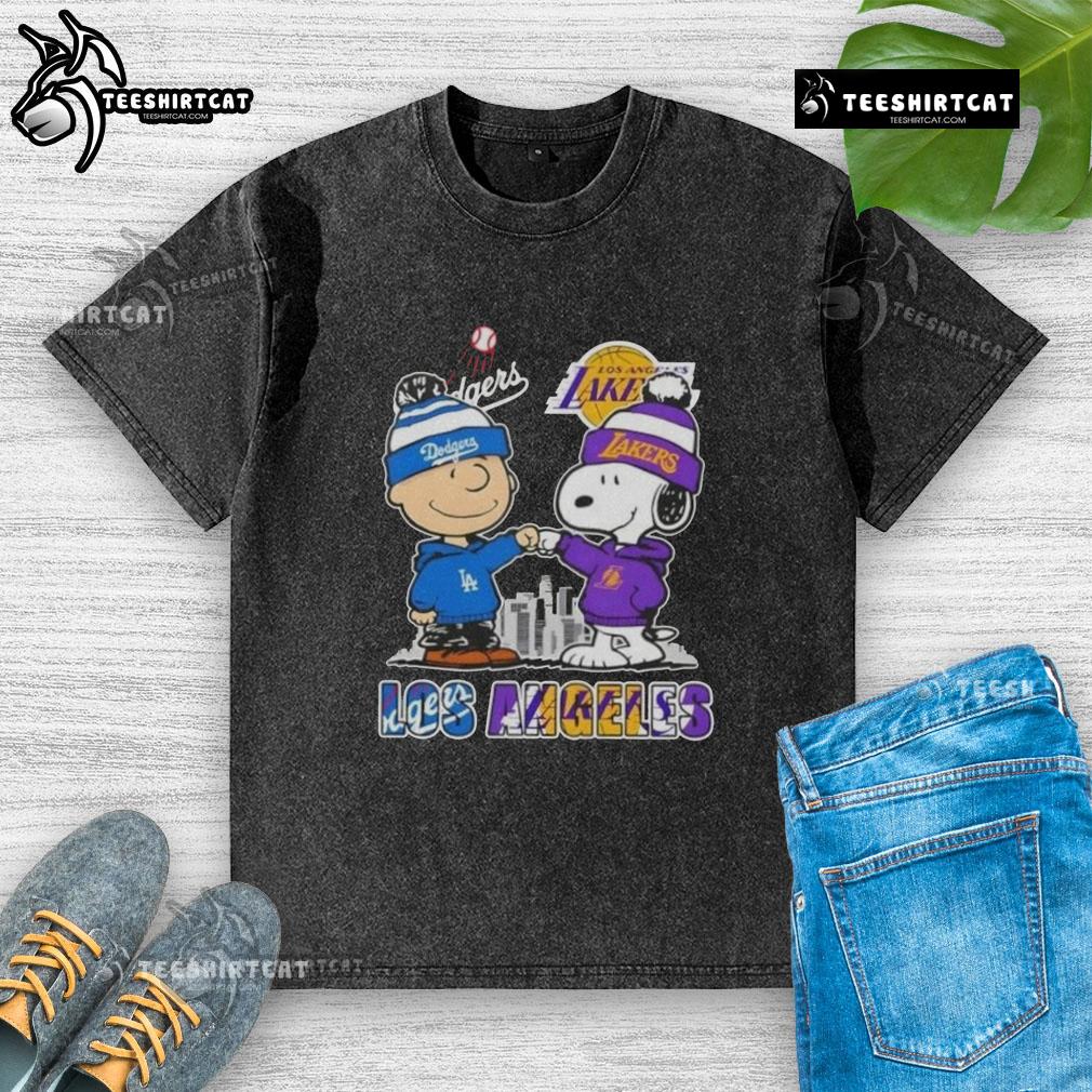 Cute Snoopy and Charlie Brown Los Angeles sports Dodgers X Lakers skyline washed t-shirt design for fans.