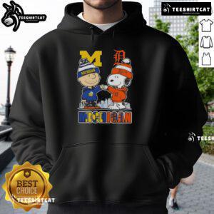 Cute Snoopy and Charlie Brown in Michigan sports hoodie featuring Wolverines and Detroit Tigers skyline design.