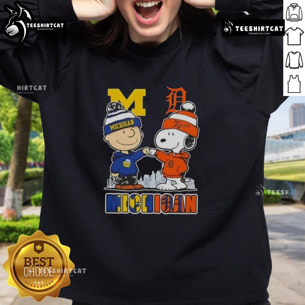 Cute Snoopy and Charlie Brown Michigan Sports sweatshirt featuring Wolverines and Detroit Tigers skyline design.