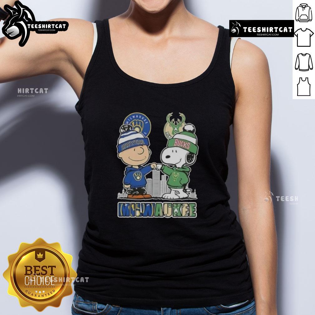 Cute Snoopy and Charlie Brown tank top featuring Milwaukee skyline with Brewers and Bucks logos.