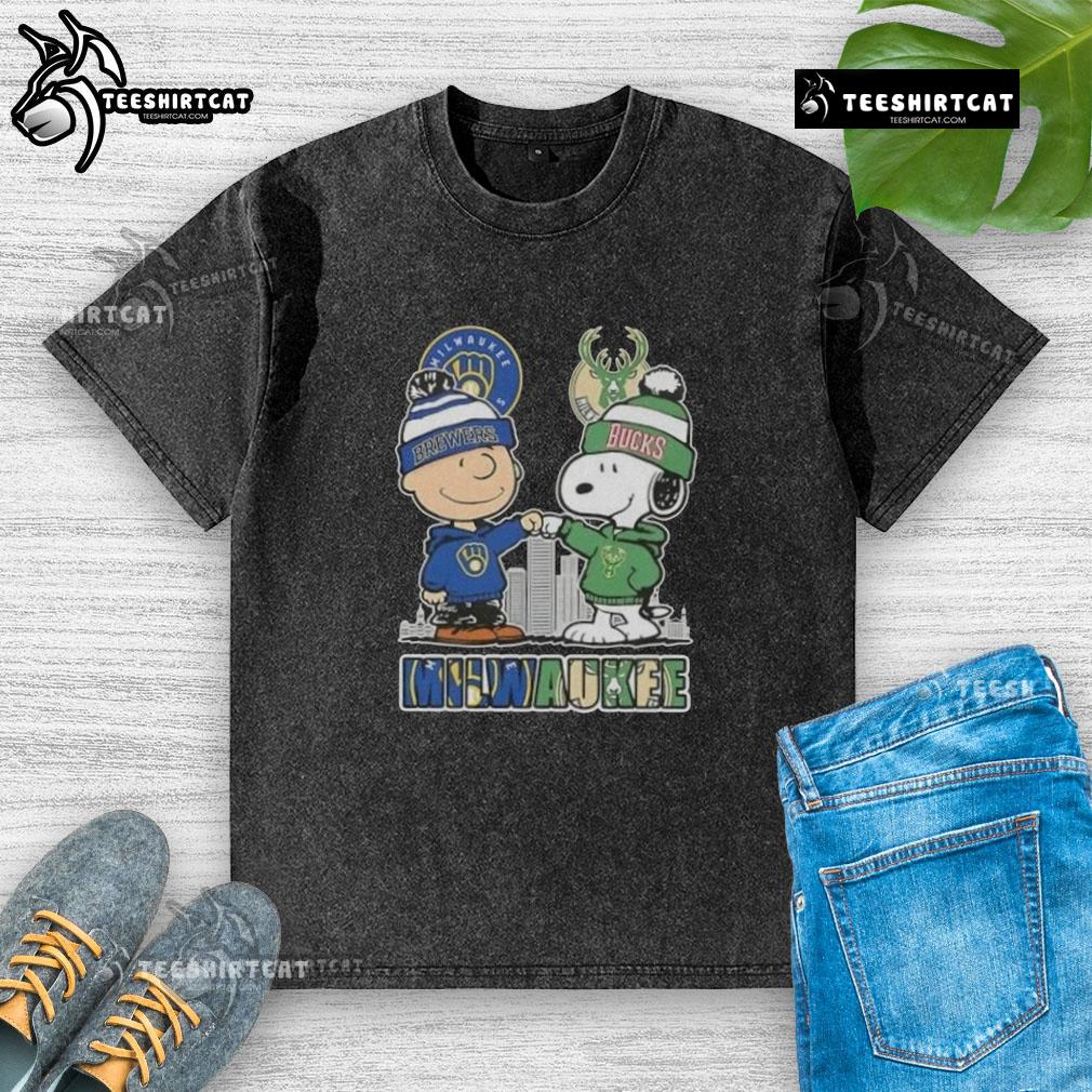 Alt Text: Cute Snoopy and Charlie Brown graphic on Milwaukee Brewers x Bucks skyline washed t-shirt, perfect for sports fans.