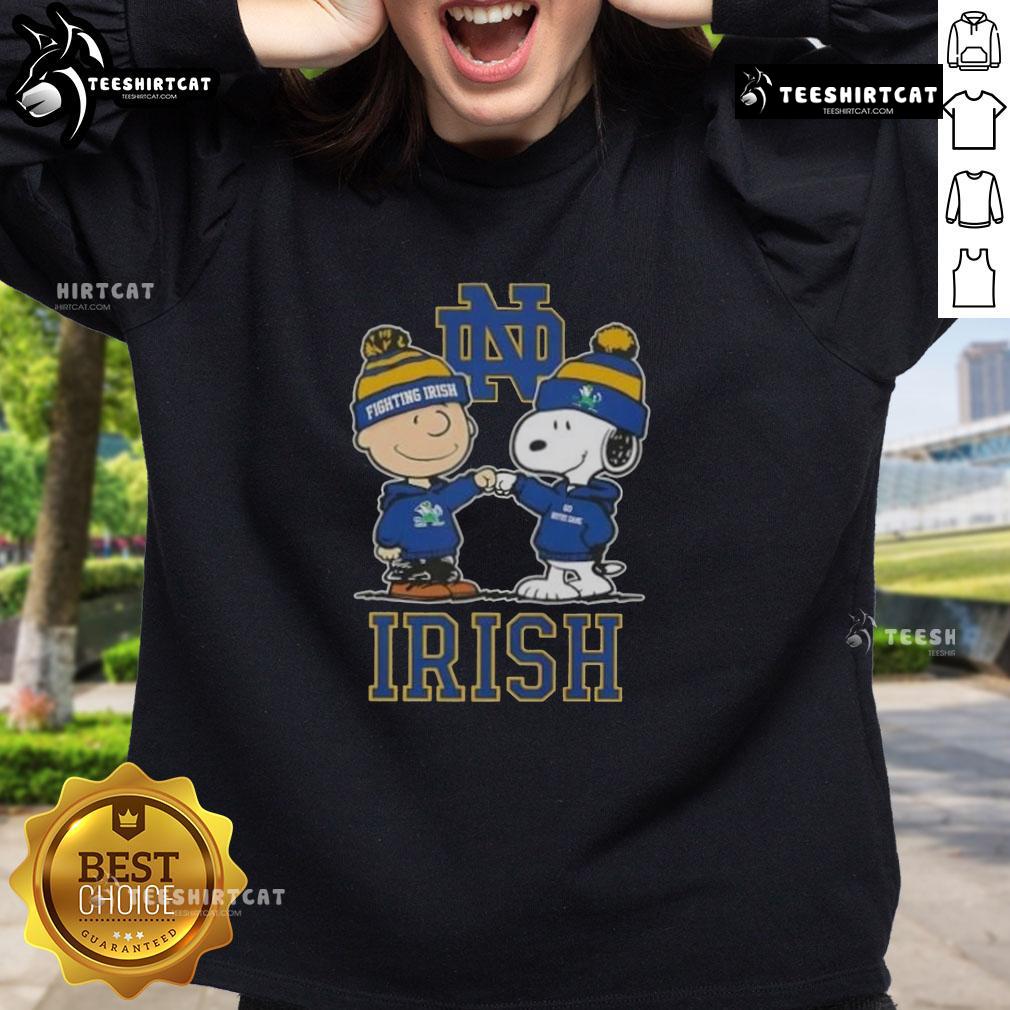 Alt Text: Cute Snoopy and Charlie Brown Notre Dame Fighting Irish football skyline sweatshirt design for fans.