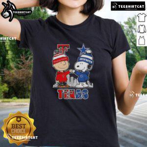 Alt Text: Cute Snoopy and Charlie Brown graphic on a Texas Tech Red Raiders vs. Dallas Cowboys skyline ladies tee shirt.