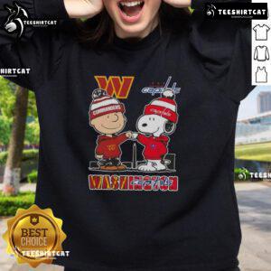Cute Snoopy and Charlie Brown sweatshirt featuring Washington Sports Commanders and Capitals skyline design.