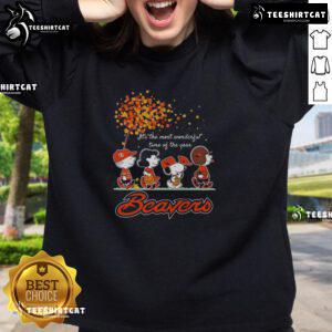 Alt Text: Cozy autumn sweatshirt featuring Good Snoopy and Friends X Beavers sports team design for the most wonderful time of the year.