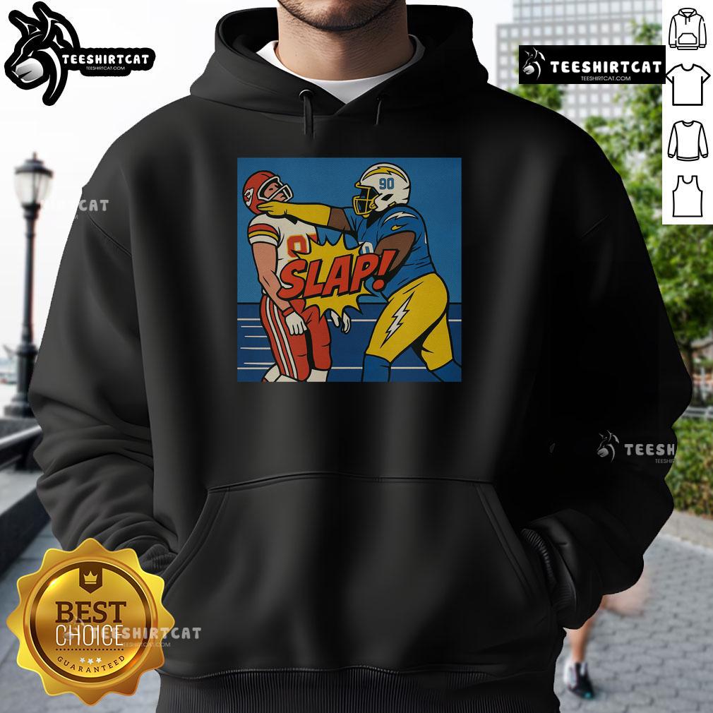 Good Teair Tart slapping Travis Kelce wearing a stylish hoodie, capturing a fun and playful moment.