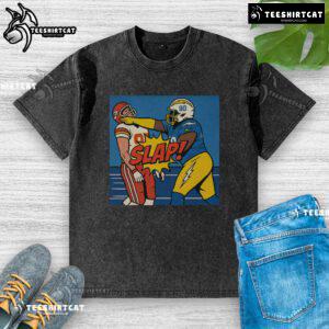 Good Teair Tart slapping Travis Kelce in a washed t-shirt, capturing a fun moment from pop culture.