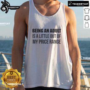 Alt Text: Woman wearing a 'Happy Being an Adult Is a Little Out of My Price Range' tank top, smiling in a sunny outdoor setting.