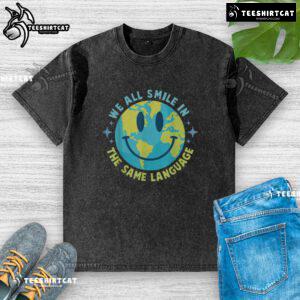 Happy Earth We All Smile In The Same Language washed t-shirt showcasing a vibrant design promoting unity and positivity.