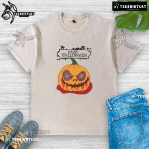 Alt Text: Happy Halloween scary pumpkin horror design on a washed t-shirt, perfect for festive celebrations and spooky style.