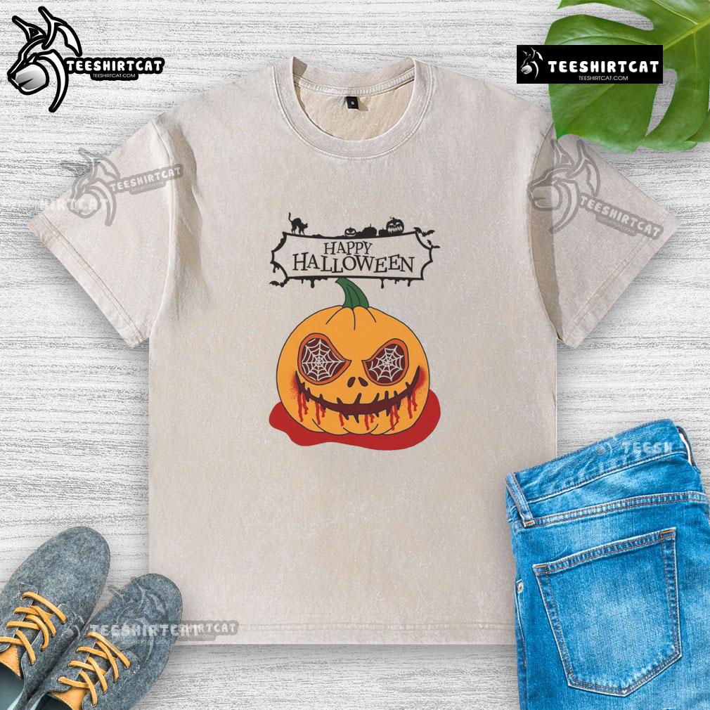 Alt Text: Happy Halloween scary pumpkin horror design on a washed t-shirt, perfect for festive celebrations and spooky style.