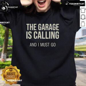 Hot-The-Garage-Is-Calling-And-I-Must-Go sweatshirt featuring a bold graphic design, perfect for automotive enthusiasts.