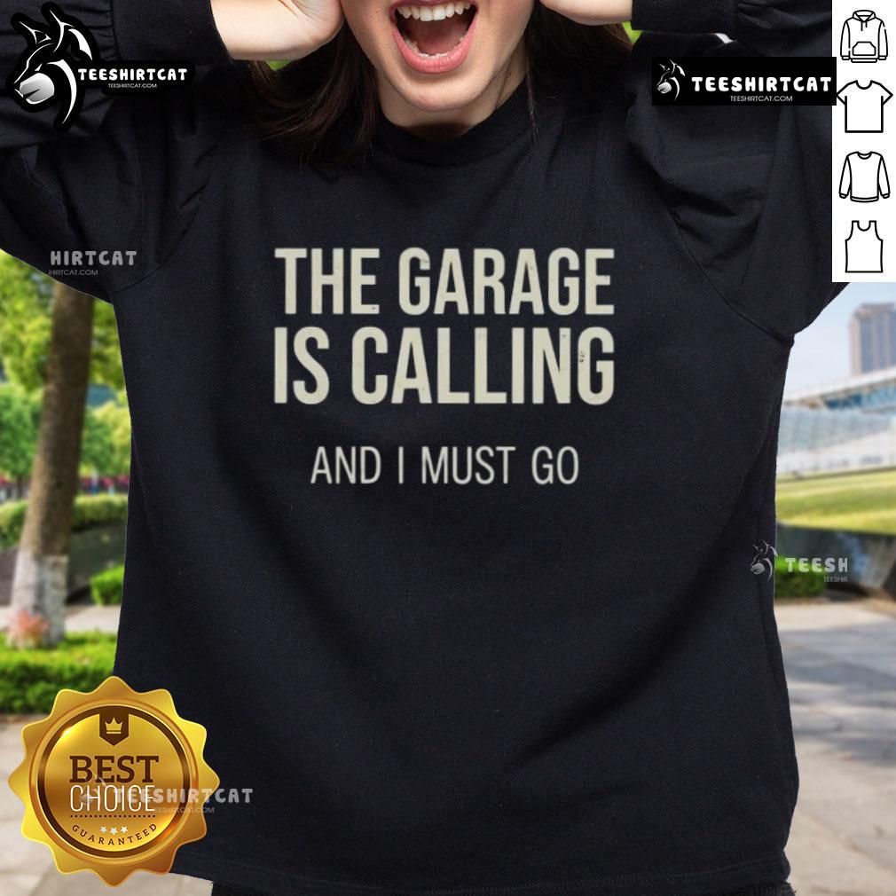 Hot-The-Garage-Is-Calling-And-I-Must-Go sweatshirt featuring a bold graphic design, perfect for automotive enthusiasts.