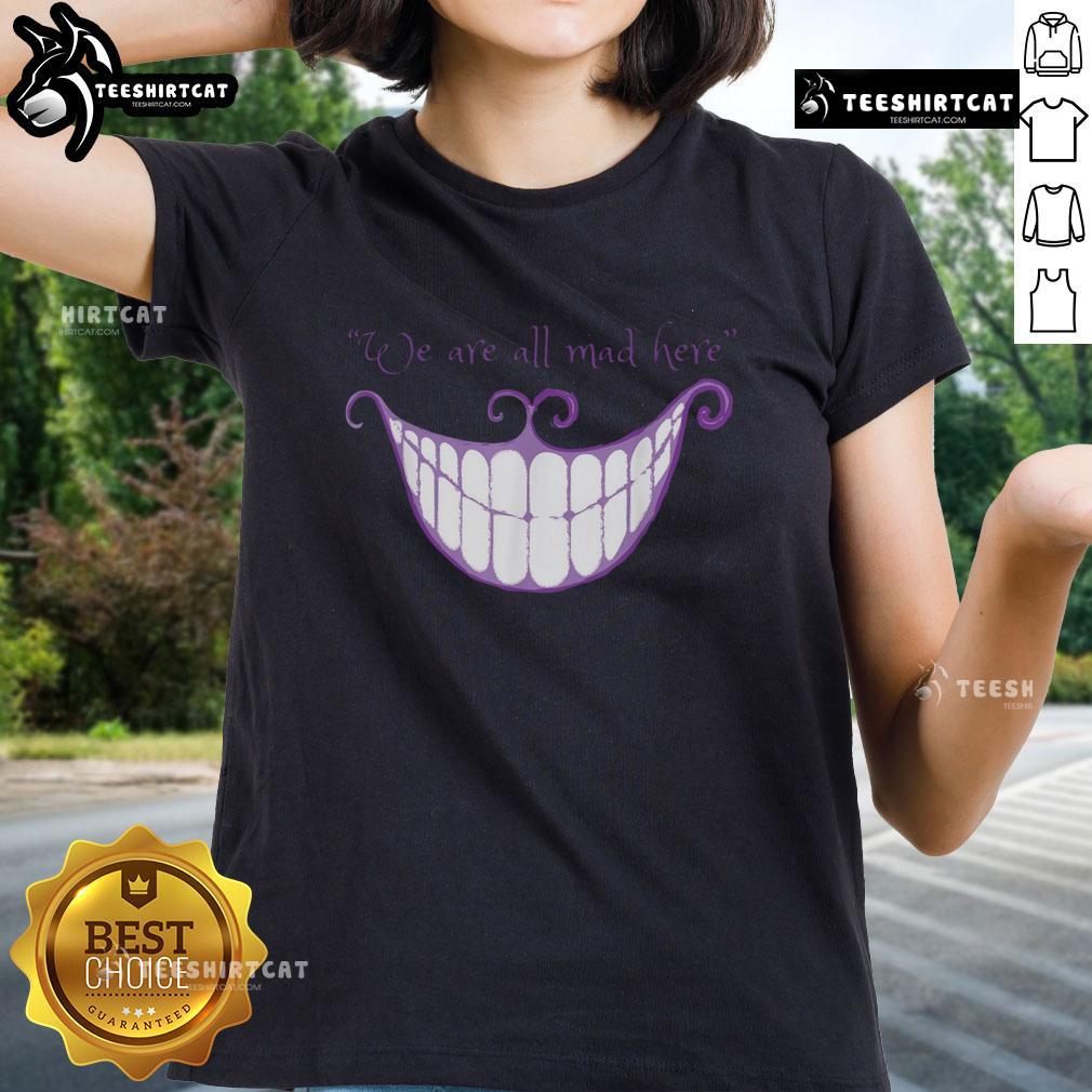 Cheshire Cat smile graphic on a ladies tee, featuring 'We Are All Mad Here' text, perfect for whimsical fashion lovers.