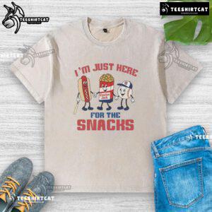 Nice Chicago Cubs I'm Just Here for the Snacks washed t-shirt displayed on a hanger, perfect for baseball fans.