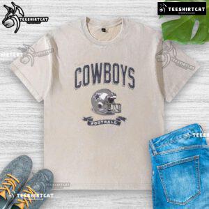 Alt Text: Distressed vintage washed t-shirt featuring a Dallas Cowboys football helmet design for fans.