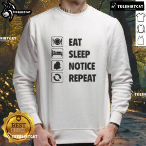 Alt Text: Cozy 'Eat Sleep Notice Repeat 2025' sweatshirt, perfect for casual wear and expressing a fun lifestyle mantra.