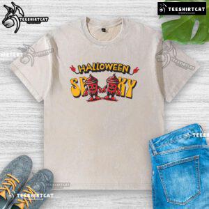 Alt Text: Spooky skeleton drink cup design on a washed T-shirt, perfect for Halloween festivities and themed apparel.